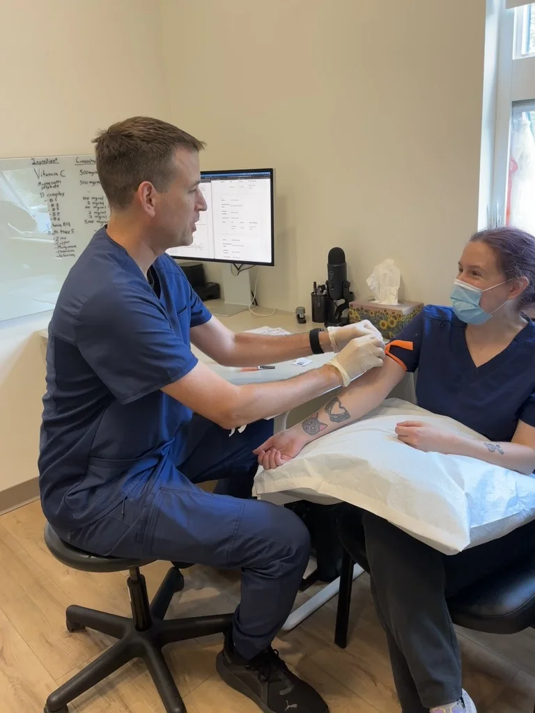 Dr. Colin MacLeod preparing a patient for in-office blood work